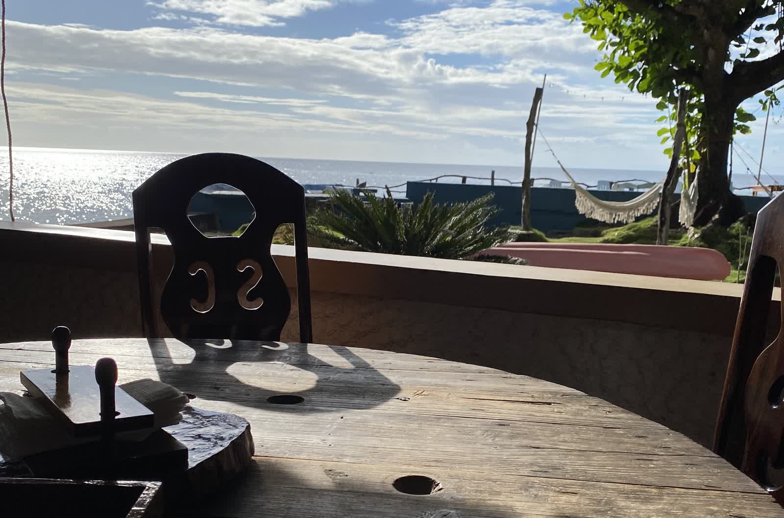 Table and chair overlooking the sea