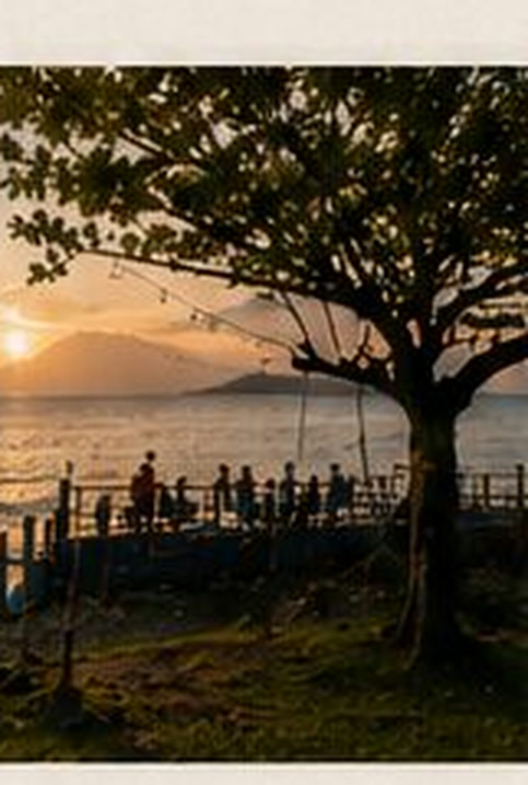 Guests at the Malambo sea terrace at sunset